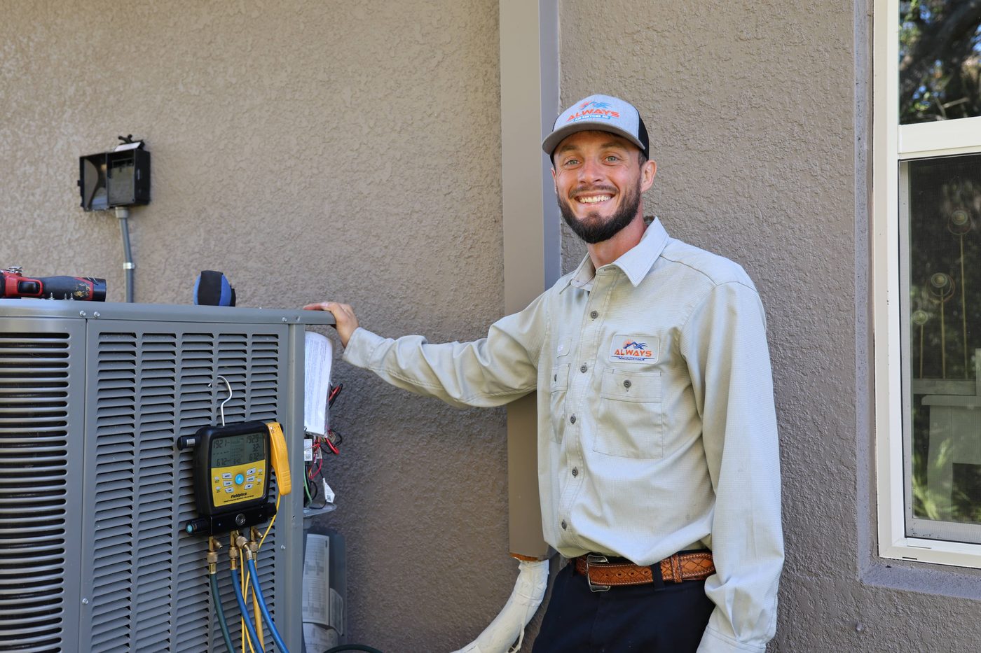 Always Air technician checking refrigerant on an outdoor AC condenser unit